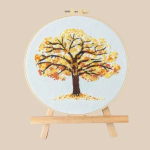 Golden autumn tree embroidery hoop with textured leaves and branches